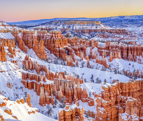 Hoodoos in Bryce Canyon National Park covered in snow.