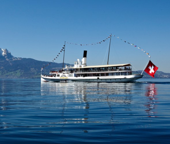 small cruise ship sailing on lake lucerne in switzerland