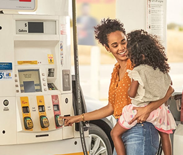 AAA Member pumping gas using the AAA discount for Shell Fuel Rewards