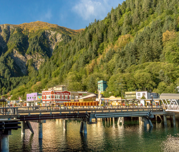 Shops and restaurants line the waterfront in Juneau, Alaska.
