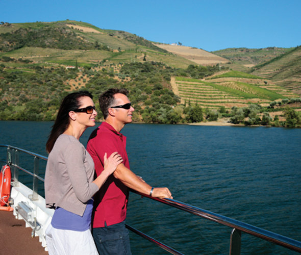couple looking at vineyards on an amawaterways river cruise in portugal