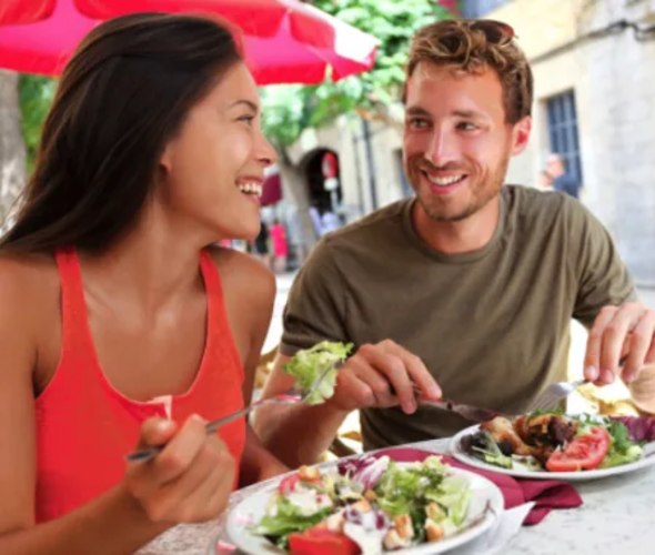 Man and Woman eating salad 