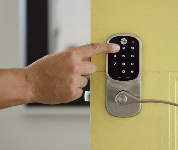 Person using smart door lock