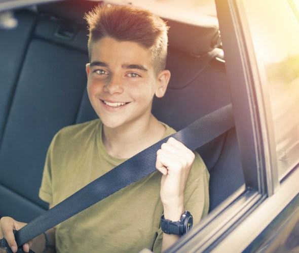 child wearing seat belt