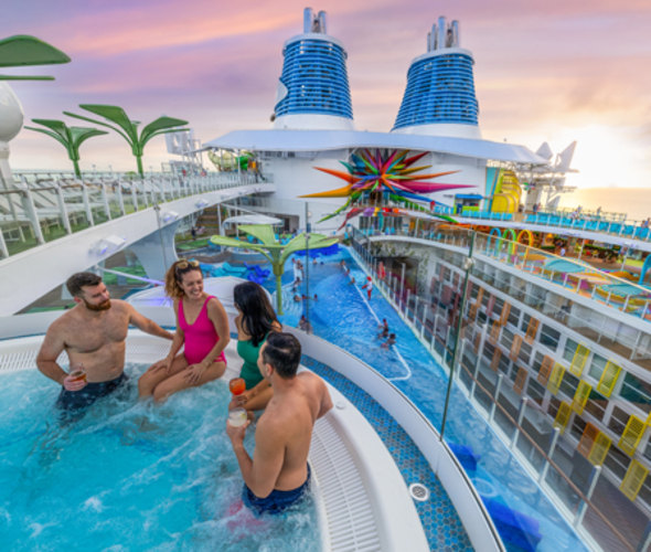 people in hot tub on icon of the seas