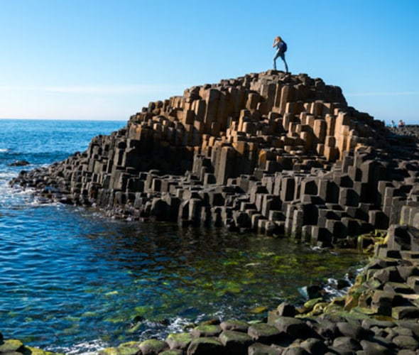 Visitor standing on Giant's Causeway 
