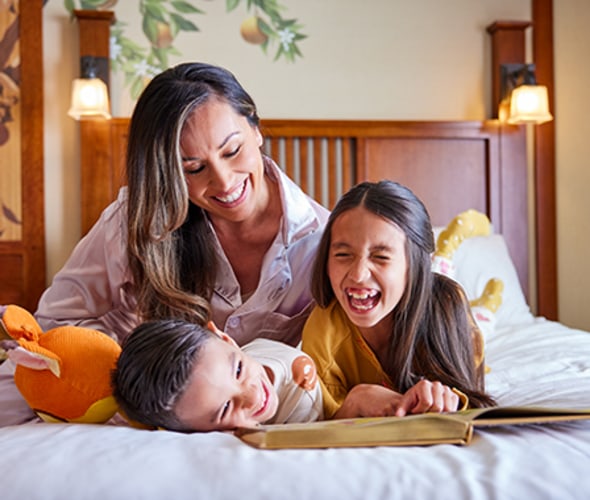 family in grand california hotel at disneyland for spring savings offer