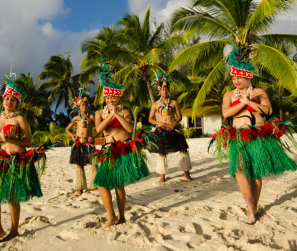 polynesian dancers on a tropical beach