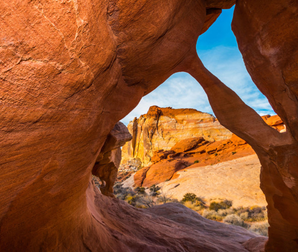 Fire Cave Arch with the White Domes in the distance in Nevada's Valley of Fire State Park.