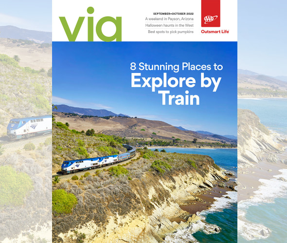 Amtrak train winds along the coast in California on the cover of Via magazine September October 2022 issue.