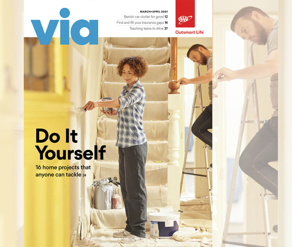 AAA Members painting their house on the cover of Via magazine's March April 2021 issue.