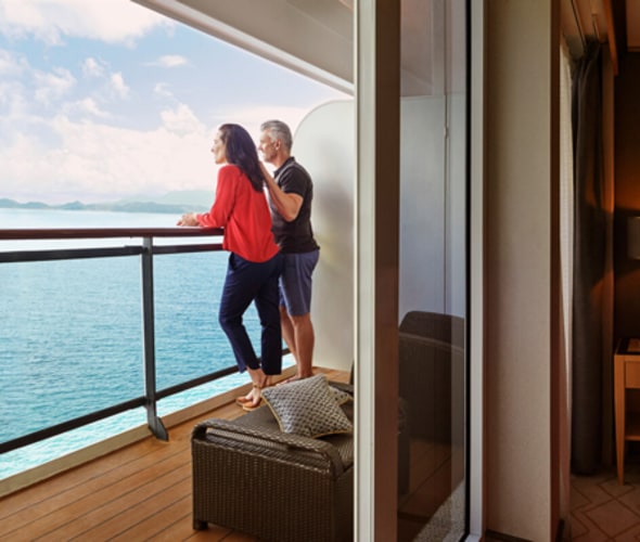 couple enjoying view from balcony on cunard cruise
