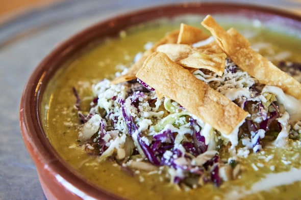 the spicy potato and corn chowder with toppings at Gadzooks Enchiladas & Soup in Phoenix, Arizona