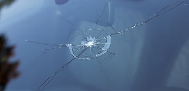 cracked front windshield ready to be replaced by technician