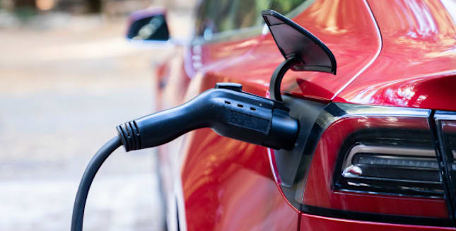 An EV is plugged in to charge