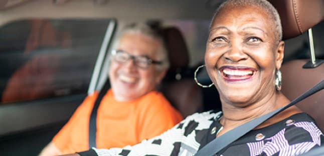 AAA Members smiling after taking an adult driving course