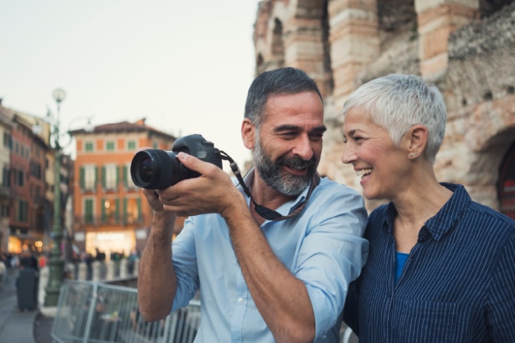 Elder couple traveling and taking pictures