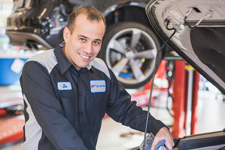  AAA auto repair mechanic inspects engine