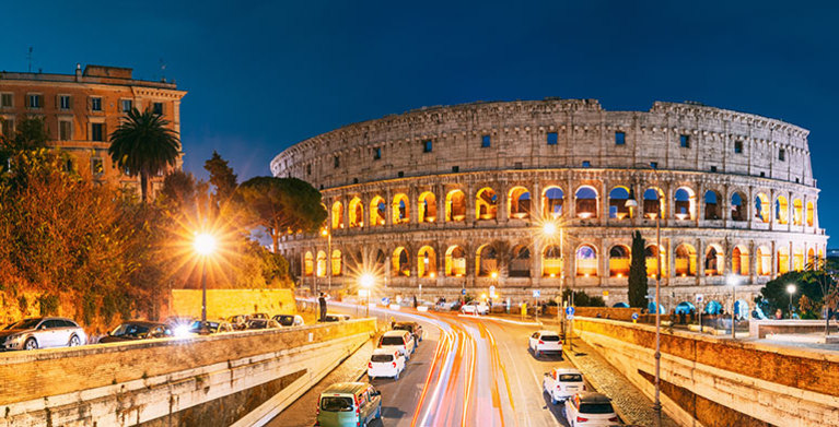 driving outside the colosseum in rome, italy