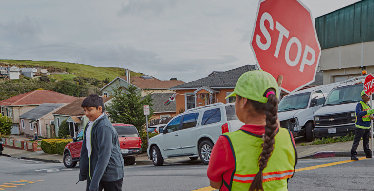 AAA School Safety patrol helping children cross the street