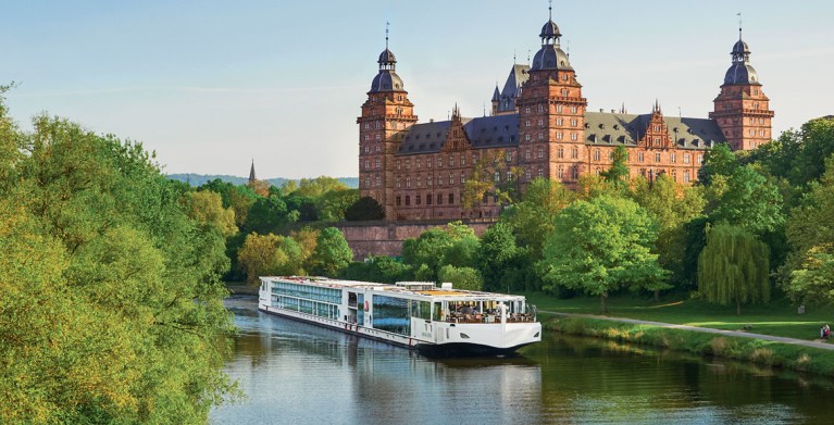viking river cruise ship on the main with a castle in the background