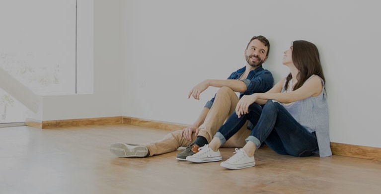 a couple with AAA Renters Insurance enjoys their new apartment