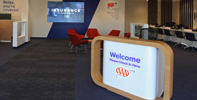 Welcome sign at the entrance to a local AAA Branch with Insurance Agents