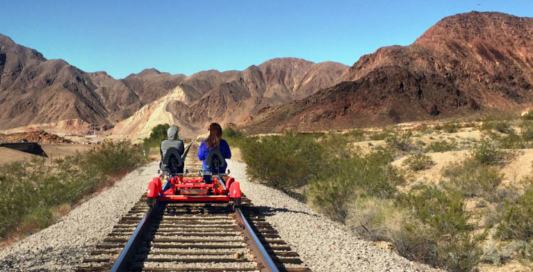 A family rides a Las Vegas Rail Explorers rail bike.