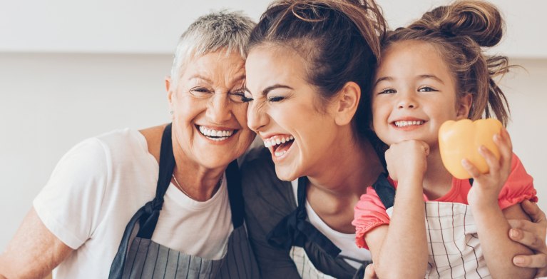 Grandma, daughter and granddaughter laughing