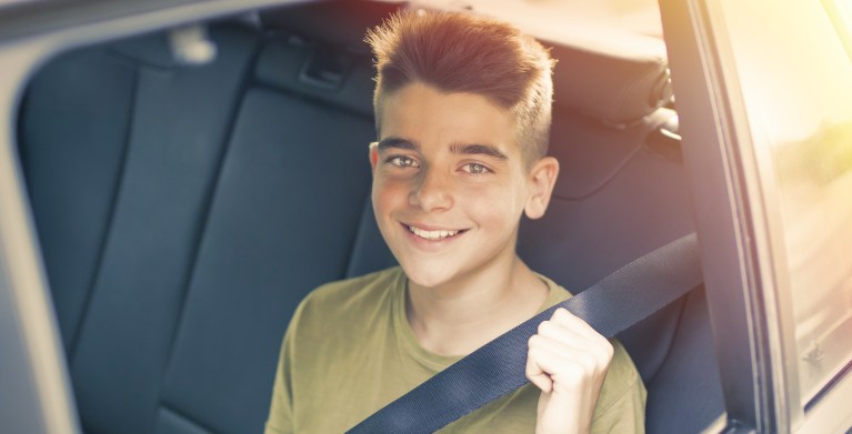 teen wearing seat belt