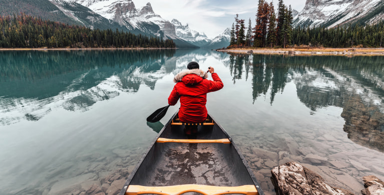 a person canoes on Maligne Lake in Canada's Jasper National Park.