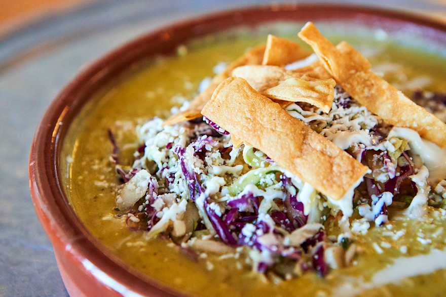 the spicy potato and corn chowder with toppings at Gadzooks Enchiladas & Soup in Phoenix, Arizona