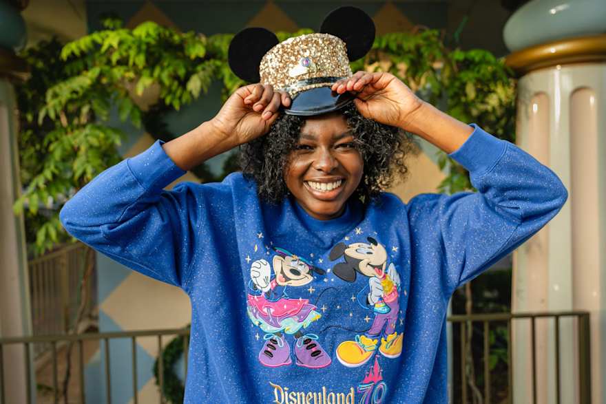 guest wearing disneyland 70th anniversary merchandise