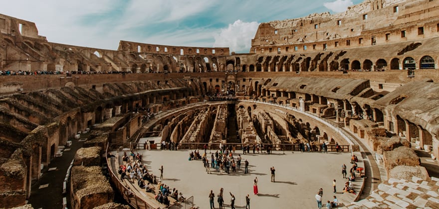 AAA Members stand in the Roman coliseum after getting help from AAA Travel Advisor