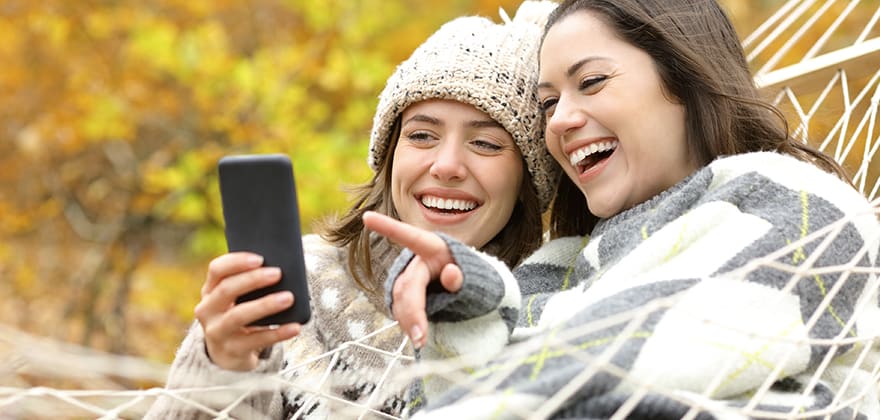 2 AAA members look at T Mobile phone