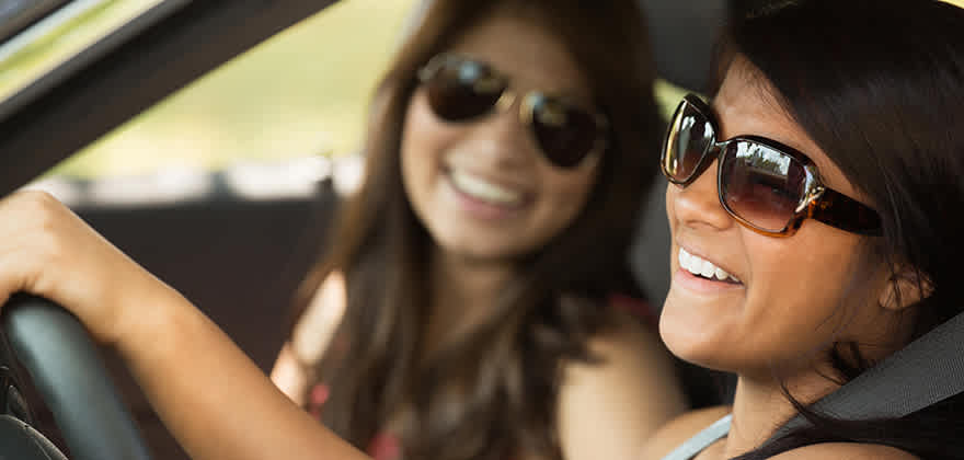 women driving car