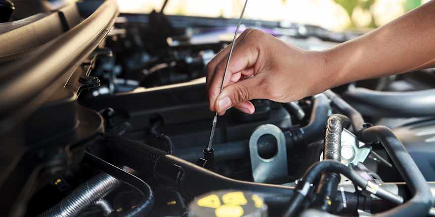 a woman's hand clutches a gearshift in a car