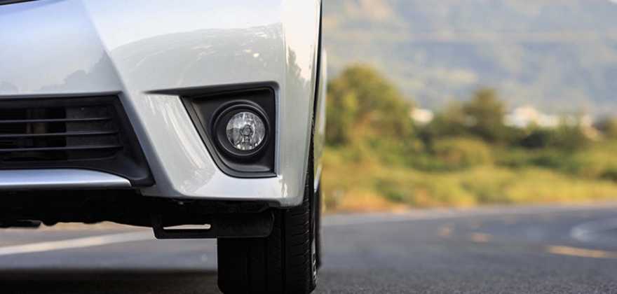 A white car owned by a AAA Member goes down the windy road