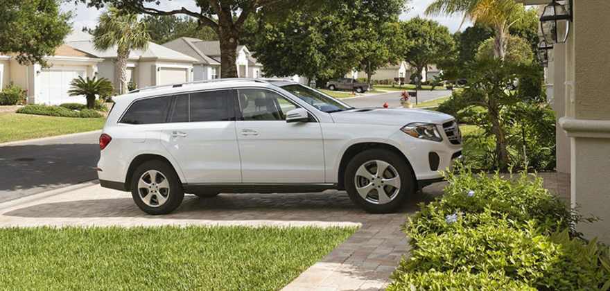 A white SUV parked in a AAA Member's driveway