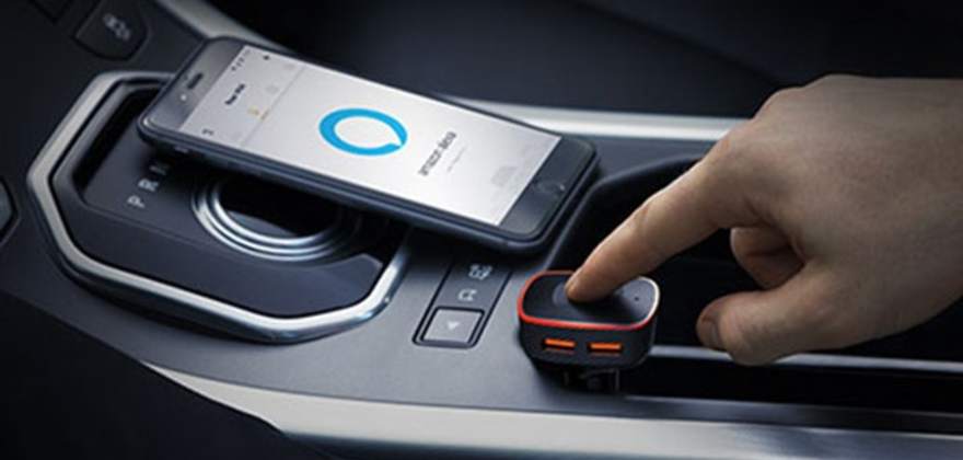 AAA member's hand on the center console of their car with a Roav Viva.