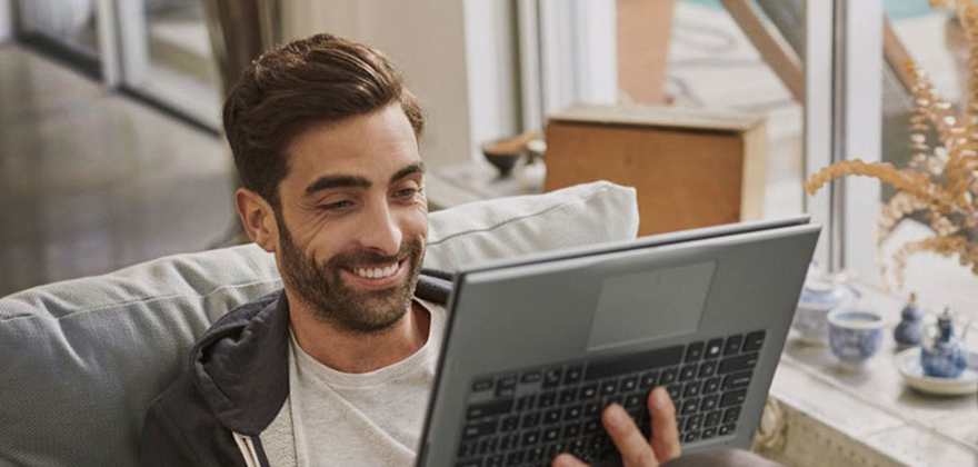 A AAA Member watches videos on his Dell laptop