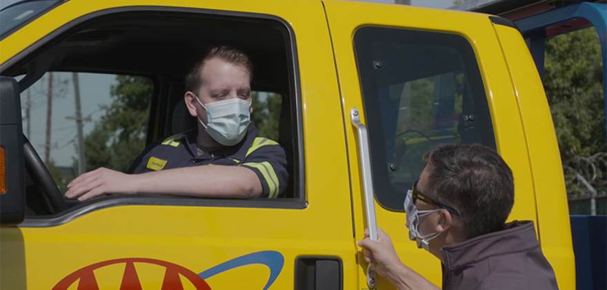 AAA's Todd Burger speaks to a Roadside Service Technician