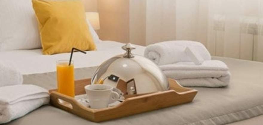 room service set up in a clean hotel room booked through aaa travel