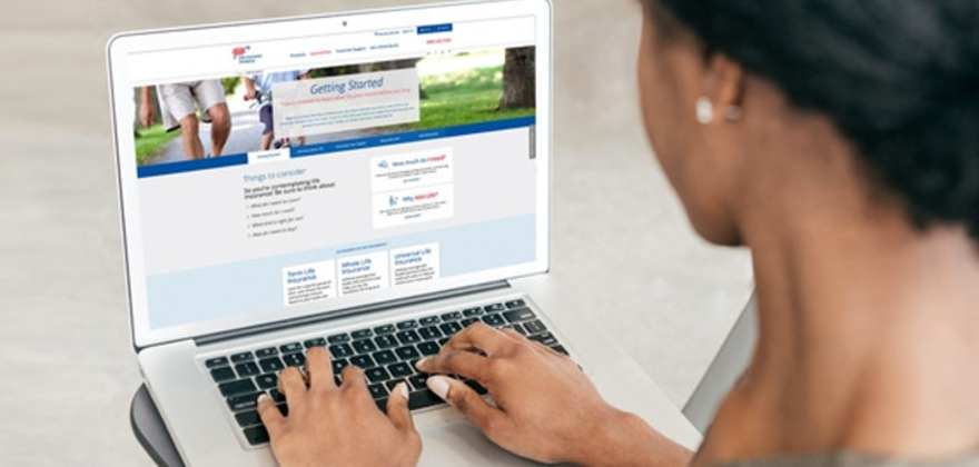 Woman researching aaa life insurance policies on her laptop
