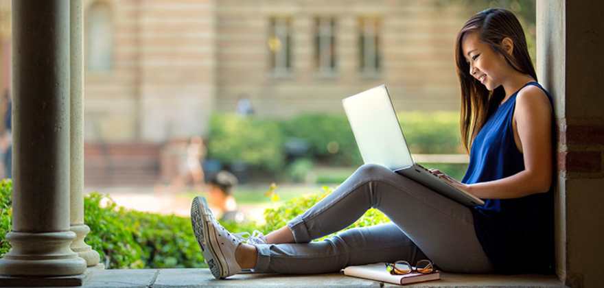 a college student studies on campus
