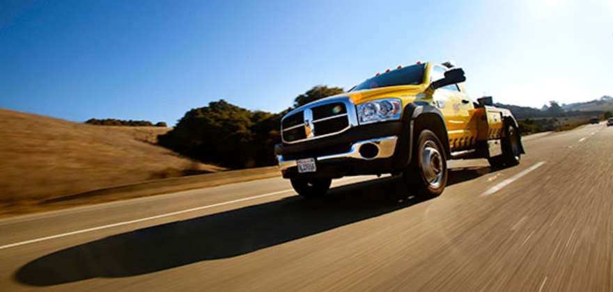 a AAA tow truck on the way to a roadside assistance call