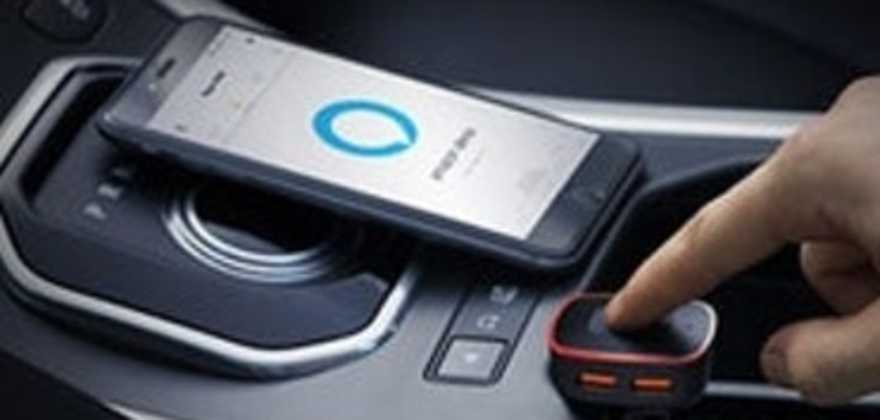 AAA Member's hands on the center console of their car with a Roav Viva