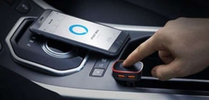 AAA Member's hands on the center console of their car with a Roav Viva