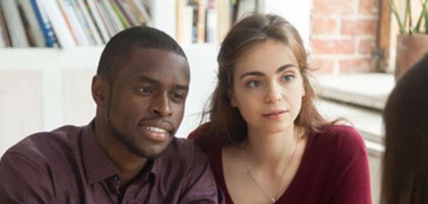 A couple signs up for AAA renters insurance