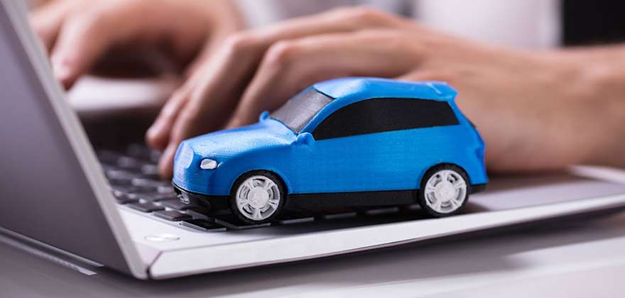 Someone on a laptop searches for AAA Gap Insurance